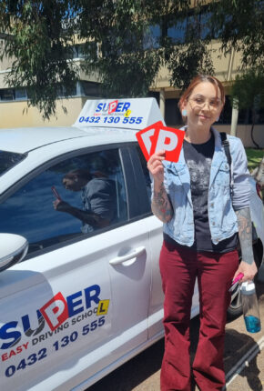 Danielle from Alkimos with her P plates after passing her driving test with Super Easy Driving School